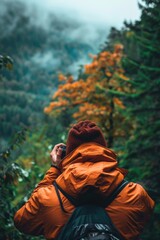 A person hiking in the wilderness with a backpack and cell phone, perfect for outdoor adventure or travel stock photos