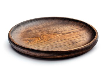 Obraz premium Close-up shot of a wooden plate on a white surface, perfect for use in still life photography or as a decorative element