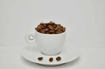 coffee, coffee beans, close-up on a white background, cup of coffee