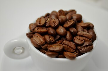 coffee, coffee beans, close-up on a white background, cup of coffee