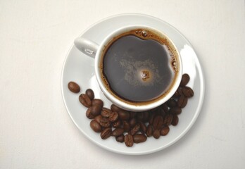coffee, coffee beans, close-up on a white background, cup of coffee