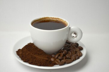 coffee, coffee beans, close-up on a white background, cup of coffee