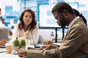 General director leading a corporate briefing meeting in conference room, reviewing economic forecasts and discussing enterprise solutions. Establishing strategic objectives for the future.