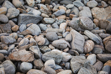 serene beach scene with smooth rocks stacked in a balanced formation. The tranquil atmosphere evokes a sense of zen, harmony, and peace, symbolizing balance and mindfulness in nature