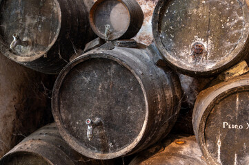 Solera system in old Andalusian wine cellar, process for aging sherry wine in barrels, fino, manzanilla, olorosso, amontillado jerez fortified wine, Sanlucar de Barrameda, Cadiz, Andalusia, Spain
