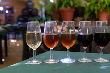 Flight of five sherry wine from barrels, fino, manzanilla, olorosso, amontillado, pedro ximenez jerez wines in old tavern, wine tasting, Sanlucar de Barrameda, Cadiz, Andalusia, Spain