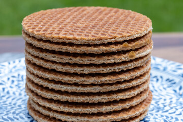 Traditional Dutch sweet dessert, Butter caramel syrup waffles, fresh baked