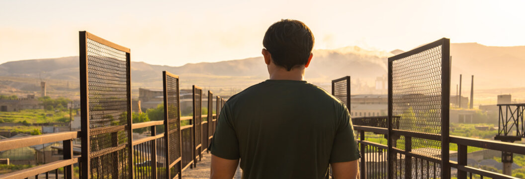 Man crossing old iron bridge, new road, psychological concept