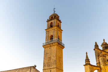 Fototapeta premium Walking in old part of Jerez de la Frontera, Sherry wine making town, Andalusia, Spain in summer, architectural details, Andalusian style, churches and towers