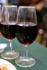 Tasting of sherry wines from barrels, fino, manzanilla, olorosso, amontillado jerez wines with traditional Andalusian tapas in old tavern, Sanlucar de Barrameda, Cadiz, Andalusia, Spain