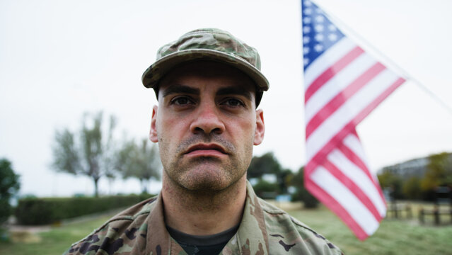 American Soldier At The Cemetery To Commemorate The War Dead During Memorial Day