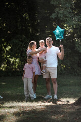 Fototapeta premium Happy family at a birthday party. Cheerful family having fun together