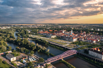 Summer aerial skyline cityscape of Głogów, Lower Silesia (Dolny Śląsk). Wide panoramic view of the old town, Bulwar Nadodrzański and Most Tolerancji bridge at sunset