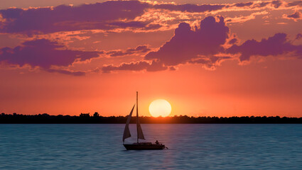 Summer Sunset on Lake Hefner in Oklahoma City, OK, USA, with a sailboat