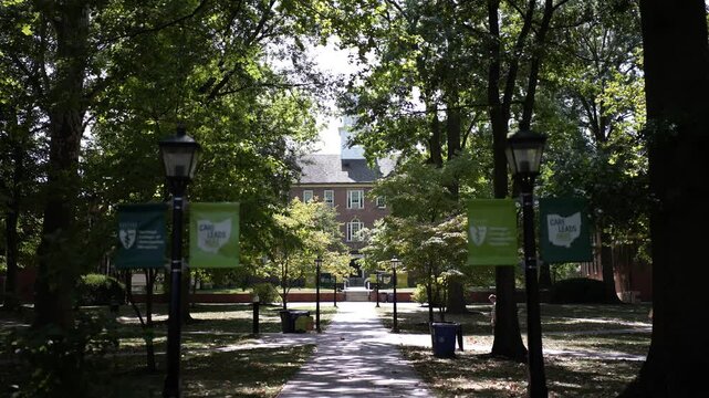 Cutler Hall on the College Green view through the trees at University of Ohio in Athens OH.