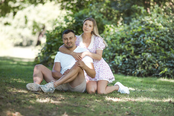 Happy couple at public park. Loving young couple having fun outdoors