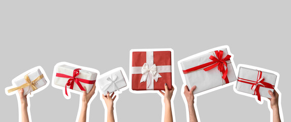 Female hands holding Christmas gift boxes on white background