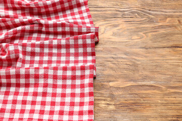 Crumpled red napkin on wooden background