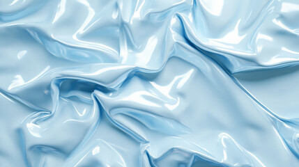 Obraz premium A glossy turquoise paper poster, crumpled with deep folds that catch the light. The texture is slick and reflective, with a modern, minimalist background