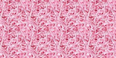 Fototapeta premium shredded paper filler in baby pink color with thin, delicate strips, shredded paper filler texture background