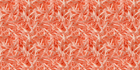 Fototapeta premium shredded paper filler in coral color with thin, delicate strips, shredded paper filler texture background