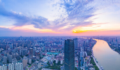 Aerial view of modern city skyline and buildings at sunrise in Shanghai