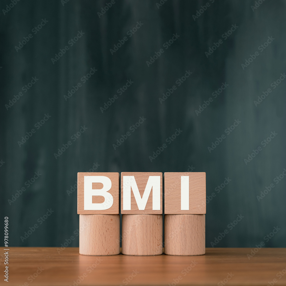 Poster there is wood cube with the word bmi. it is an abbreviation for brain machine interface as eye-catch