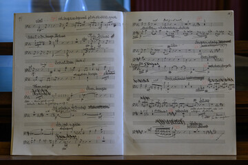 Naklejka premium View of piano sheet music in a notebook with German description. 