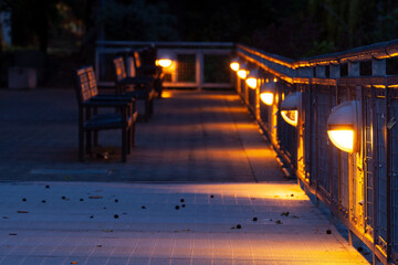 Romantic evening with empty benches and lanterns, lamps, captured at twilight, near Waterfront of Portland, oregon