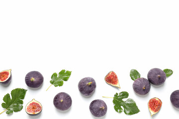 Fresh ripe figs with leaves on a white background