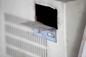 Close-up of an old metal with a hole in it