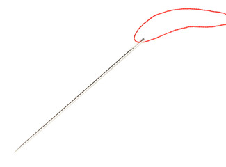 Sewing needle with red thread isolated on white