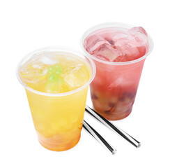 Tasty bubble tea in plastic cups and straws isolated on white