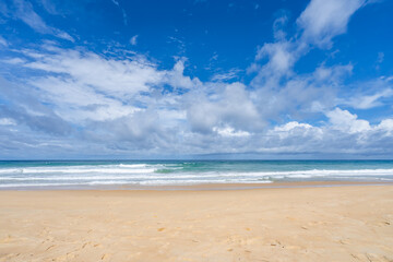Fototapeta premium Beautiful tropical beach summer seascape,Amazing sandy beach and sea in sunny day,Blue sky in good weather day, Beach sea space area nature background