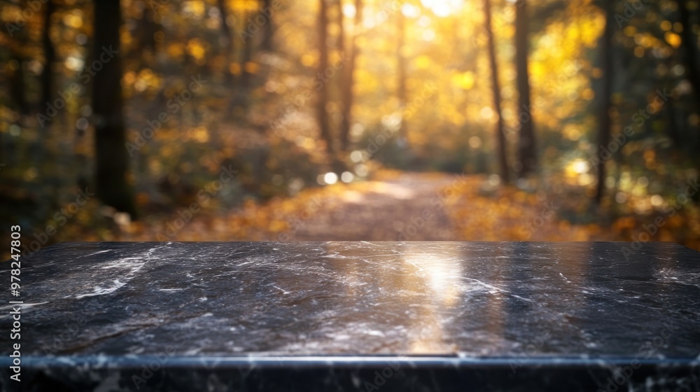 Poster a dark marble surface in the foreground with a blurred autumn forest path in the background.