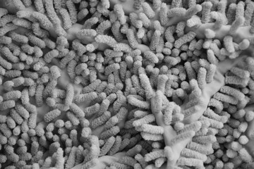 Processed image of fluffy gray doormat from bathroom in grey color