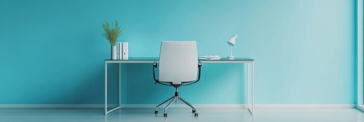 A minimalist workspace featuring a desk, chair, lamp, and decorative plant against a blue wall.