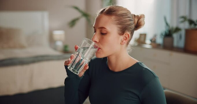 Woman, supplements and water for drugs in home, fitness girl and iron for detox treatment. Female person, weight loss tablets and sportswear for exercise recovery, aspirin and liquid for vitamin
