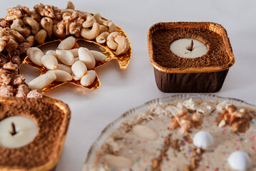 Candle-shaped dessert with chocolate and nuts
