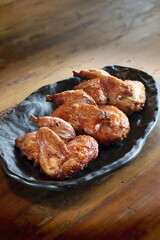 pieces of roast chicken, known in Brazil as galeto on the plate