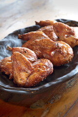 pieces of roast chicken, known in Brazil as galeto on the plate