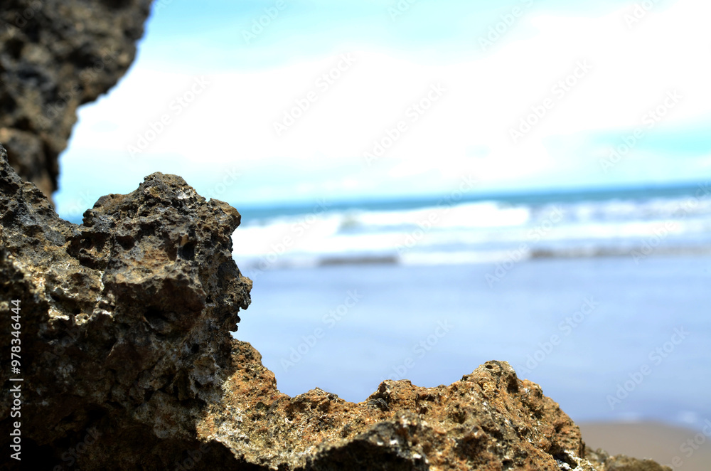 Wall mural the sturdy rocks that protect the land on the coast from the onslaught of waves