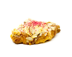 Almond croissants with sliced ​​almonds and dried raspberries sprinkled on top on an isolated white background