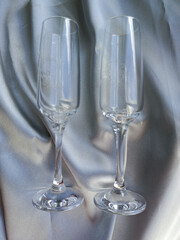Two glasses on gray silk. Paired wedding glasses on silver silk fabric. Gift for a wedding, anniversary. Wine glasses.