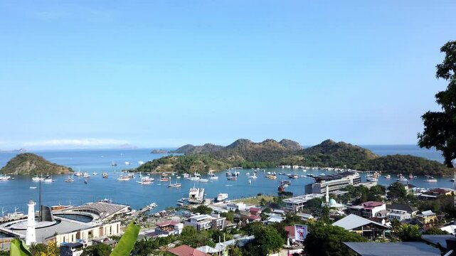 Harbour of Labuan Bajo, Ost Nusa Tenggara, Flores, Indonesia, Southeast Asia.
Island Monyet on the left, Islands Bajo, Kelapa and Seture on the right, Komodo National Park in the background.