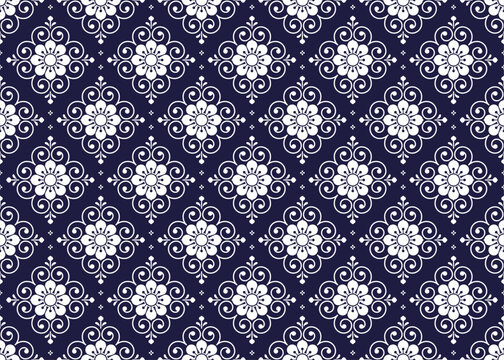 Fototapeta White symbol floral on dark blue background, ethnic fabric seamless pattern, design for cloth, carpet, batik, wallpaper, wrapping etc.