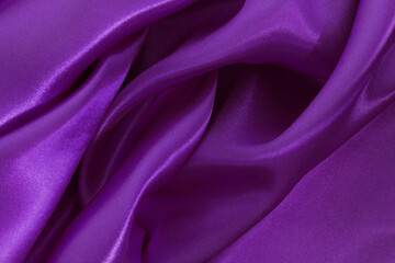 Dark purple fabric texture background, detail of silk or linen pattern.