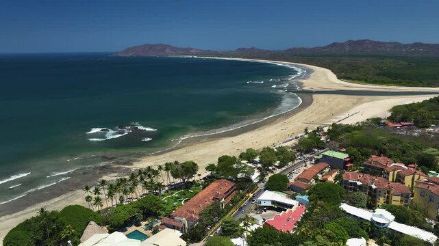 Aerial view over the Tamarindo town and a beach, in sunny Guanacaste, Costa Rica