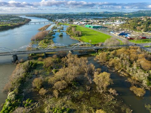 Swamp land on the banks of the Waikato River and road bridge crossing into Huntly, Waikato, New Zealand.