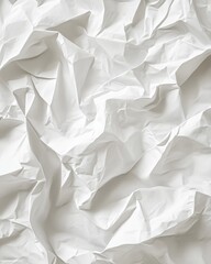 Fototapeta premium A close-up of crumpled white paper highlights folds and shadows, evoking elegance for artistic projects.